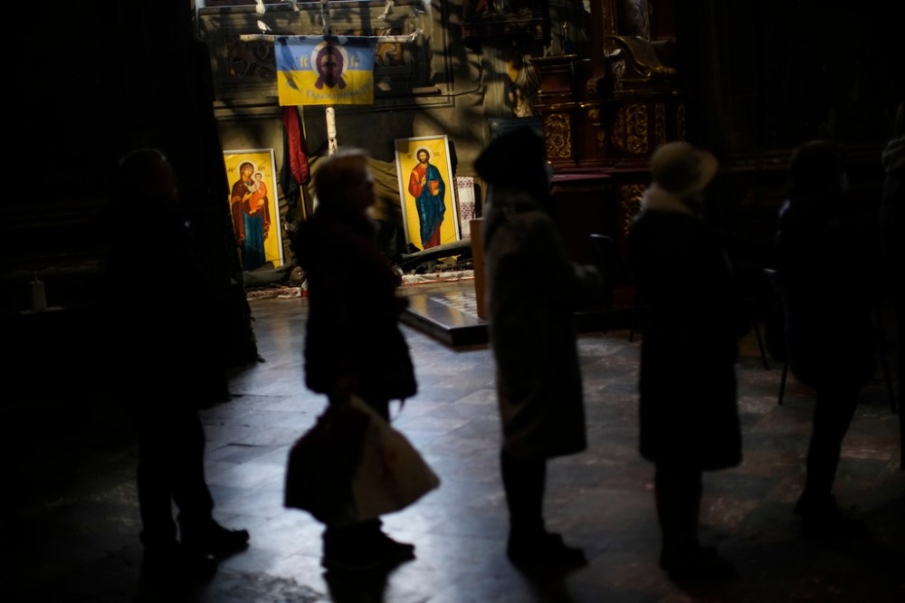 CP
Worshippers wait in line to kiss what represents the coffin of Jesus Christ during Easter Orthodox Christian celebrations at Saints Peter and Garrison church in Lviv, on, April 22. (Francisco Seco / The Associated Press)