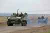 FILE - Russian military vehicles move on a highway in an area controlled by Russian-backed separatist forces near Mariupol, Ukraine, April 18, 2022. Mariupol, a strategic port on the Sea of Azov, has been besieged by Russian troops and separatist forces in eastern Ukraine for more than six weeks. (AP Photo/Alexei Alexandrov, File)