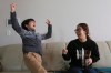 Parasite actor Jeong Hyeonjun, left, and his mother Lee Min Jae celebrate as they watch a TV live broadcasting of South Korean director Bong Joon Ho receiving the award for best original screenplay for 