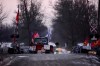 A protester looks through a pair of binoculars from the closed train tracks in Tyendinaga, near Belleville, Ont., on Sunday Feb.23, 2020. The rail blockade is in support of the Wet'suwet'en who oppose work on a pipeline in northern B.C. THE CANADIAN PRESS/Sean Kilpatrick