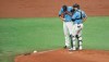 Tampa Bay Rays starter Charlie Morton, left, talks with catcher Mike Zunino, right, on the mound during the first inning of a baseball game against the New York Yankees, Sunday, Aug. 9, 2020, in St. Petersburg, Fla. (AP Photo/Steve Nesius)