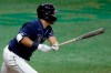Tampa Bay Rays' Yoshitomo Tsutsugo, of Japan, lines a two-run single off Atlanta Braves starting pitcher Kyle Wright during the third inning of a baseball game Tuesday, July 28, 2020, in St. Petersburg, Fla. Rays' Kevin Kiermaier and Brandon Lowe score on the play. (AP Photo/Chris O'Meara)