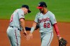 Washington Nationals' Luis Garcia (62) and Asdrubal Cabrera (13) celebrate after the team defeated the Tampa Bay Rays during a baseball game Wednesday, Sept. 16, 2020, in St. Petersburg, Fla. (AP Photo/Chris O'Meara)