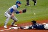 Tampa Bay Rays' Randy Arozarena slides into third base with a triple as Toronto Blue Jays' Cavan Biggio, left, waits for the throw during the fourth inning of Game 1 of a wild card series playoff baseball game Tuesday, Sept. 29, 2020, in St. Petersburg, Fla. (AP Photo/Chris O'Meara)