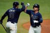 Tampa Bay Rays' Brett Phillips celebrates his solo home run off Philadelphia Phillies relief pitcher Tommy Hunter with catcher Mike Zunino (10) during the sixth inning of a baseball game Friday, Sept. 25, 2020, in St. Petersburg, Fla. (AP Photo/Chris O'Meara)