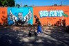 Ronaly Brooks walks past a mural in the neighborhood where George Floyd grew up Tuesday, April 20, 2021, in Houston. Former Minneapolis police Officer Derek Chauvin has been convicted of murder and manslaughter in the death of George Floyd, the explosive case that triggered worldwide protests, violence and a furious reexamination of racism and policing in the U.S. (AP Photo/David J. Phillip)