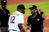 Umpire Chris Guccione, right, talks to Houston Astros manager Dusty Baker (12) after both benches emptied onto the field after the sixth inning of a baseball game against the Los Angeles Dodgers Tuesday, July 28, 2020, in Houston. (AP Photo/David J. Phillip)