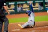 Texas Rangers' Isiah Kiner-Falefa scores during the 10th inning of a baseball game against the Houston Astros Tuesday, Sept. 1, 2020, in Houston. (AP Photo/David J. Phillip)