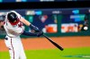 Atlanta Braves' Dansby Swanson hits a home run during the second inning in Game 2 of a baseball National League Division Series against the Miami Marlins Wednesday, Oct. 7, 2020, in Houston. (AP Photo/Eric Gay)
