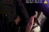 In this image made from a March 28, 2019, body-worn camera video provided by the Austin Police Department in Texas, Williamson County deputies hold down Javier Ambler as one of them uses a Taser on Ambler’s back during his arrest in Austin, Texas. The black man died in custody in 2019 after sheriff's deputies repeatedly used stun guns on him, despite his pleas that he was sick and couldn't breathe, according a report published Monday, June 8, 2020, by the Austin American-Statesman and KVUE-TV. The video was made on the camera worn by an Austin police officer who also showed up at the scene as Williamson County deputies were making the arrest. (Austin Police Department via AP)