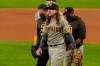 San Diego Padres starting pitcher Mike Clevinger leaves the game with an injury during the second inning in Game 1 of a baseball NL Division Series against the Los Angeles Dodgers, Tuesday, Oct. 6, 2020, in Arlington, Texas. (AP Photo/Tony Gutierrez)