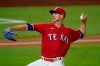 Texas Rangers starting pitcher Mike Minor throws to the Los Angeles Dodgers in the fourth inning of a baseball game in Arlington, Texas, Friday, Aug. 28, 2020. (AP Photo/Tony Gutierrez)