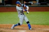 Los Angeles Dodgers' Justin Turner connects for a run-scoring single to left in the seventh inning of a baseball game against the Texas Rangers in Arlington, Texas, Friday, Aug. 28, 2020. The hit scored Corey Seager. (AP Photo/Tony Gutierrez)