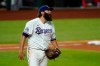 Texas Rangers starting pitcher Lance Lynn yells out after walking Los Angeles Angels' Jo Adell in the seventh inning of a baseball game in Arlington, Texas, Tuesday, Sept. 8, 2020. (AP Photo/Tony Gutierrez)