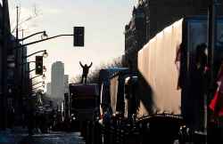 CP
A person pumps their fists as they stand on top of a transport truck after arriving on Wellington Street in front of on Parliament Hill as part of a cross-country convoy protesting measures taken by authorities to curb the spread of COVID-19, in Ottawa, on Friday, Jan. 28, 2022. THE CANADIAN PRESS/Justin Tang