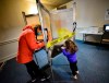 Tricia Suriani, of Brattleboro, Vt., fills out her ballot while her 2-year-old daughter, Clemencia, draws a picture inside a voting booth during Election Day, on Tuesday, Nov. 3, 2020 in Brattleboro, Vt. (Kristopher Radder /The Brattleboro Reformer via AP)