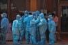 CP
Health workers and volunteers in personal protective suits wait to receive patients outside a COVID-19 hospital that was set up at a Sikh Gurdwara in New Delhi, India, Monday, May 10, 2021. (AP Photo/Ishant Chauhan)