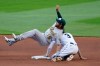Oakland Athletics second baseman Chad Pinder (18) falls onyo Seattle Mariners' J.P. Crawford after tagging Crawford out at second base on a stolen-base attempt during the fifth inning of a baseball game Saturday, Aug. 1, 2020, in Seattle. (AP Photo/Elaine Thompson)