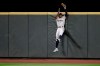 Seattle Mariners right fielder Kyle Lewis makes a leaping catch at the wall of a fly ball hit by Los Angeles Angels' Jason Castro during the seventh inning of a baseball game Tuesday, Aug. 4, 2020, in Seattle. (AP Photo/Ted S. Warren)