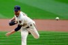 Milwaukee Brewers' Brett Anderson pitches during the first inning of a baseball game against the Cincinnati Reds, Monday, Aug. 24, 2020, in Milwaukee. (AP Photo/Aaron Gash)