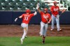 Cincinnati Reds' Jesse Winker (33) celebrates with teammate Eugenio Suarez (7) after hitting a solo home run during the third inning of the first baseball game of a doubleheader against the Milwaukee Brewers, Thursday, Aug. 27, 2020, in Milwaukee. (AP Photo/Aaron Gash)