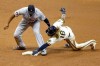 Milwaukee Brewers' Ben Gamel (16) reaches for second base as he's tagged out by Detroit Tigers' Jonathan Schoop during the third inning of a baseball game Tuesday, Sept. 1, 2020, in Milwaukee. (AP Photo/Aaron Gash)