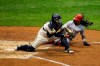 Cincinnati Reds' Freddy Galvis, right, is forced out by Milwaukee Brewers' Omar Narvaez during the fifth inning of a baseball game Tuesday, Aug. 25, 2020, in Milwaukee. (AP Photo/Aaron Gash)