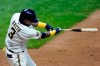 Milwaukee Brewers' Orlando Arcia hits an RBI single during the eighth inning of a baseball game against the Pittsburgh Pirates Monday, Aug. 31, 2020, in Milwaukee. (AP Photo/Morry Gash)