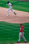 Cincinnati Reds reliever Joel Kuhnel looks back after Milwaukee Brewers' Christian Yelich hits a home run during the seventh inning of a baseball game Sunday, Aug. 9, 2020, in Milwaukee. (AP Photo/Morry Gash)