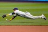 Milwaukee Brewers' Orlando Arcia can't catch a ball hit by Chicago White Sox Nomar Mazara during the eighth inning of a baseball game Monday, Aug. 3, 2020, in Milwaukee. (AP Photo/Morry Gash)