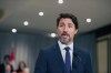 Prime Minister Justin Trudeau stands in front of his cabinet as he speaks to media during the final day of the Liberal cabinet retreat at the Fairmont Hotel in Winnipeg, Tuesday, Jan. 21, 2020. THE CANADIAN PRESS/Mike Sudoma