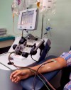 FILE - In this file photo dated Wednesday, May 13, 2020, a recovered COVID-19 patient donates blood products, known as convalescent plasma, at the Arnulfo Arias Madrid Hospital, in Panama City. The U.S. Food and Drug Administration authorized the use of blood plasma for what's called “emergency use” during the coronavirus pandemic, but the World Health Organization (WHO) on Monday AUG. 24, 2020, cautioned that using blood plasma from COVID-19 survivors to treat other patients is still considered an experimental therapy. (AP Photo/Arnulfo Franco, FILE)