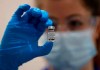 A nurse holds a phial of the Pfizer-BioNTech COVID-19 vaccine at Guy's Hospital in London, Tuesday, Dec. 8, 2020, as the U.K. health authorities rolled out a national mass vaccination program. U.K. regulators said Wednesday Dec. 9, 2020, that people who have a “significant history’’ of allergic reactions shouldn’t receive the new Pfizer/BioNTech vaccine while they investigate two adverse reactions that occurred on the first day of the country’s mass vaccination program. (AP Photo/Frank Augstein, Pool)