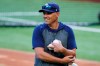 Tampa Bay Rays manager Kevin Cash throws batting practice before Game 1 of the baseball World Series Series against the Los Angeles Dodgers Tuesday, Oct. 20, 2020, in Arlington, Texas. (AP Photo/Tony Gutierrez)
