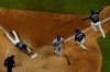 Tampa Bay Rays' Randy Arozarena touches after scoring the winning run against the Los Angeles Dodgers in Game 4 of the baseball World Series Saturday, Oct. 24, 2020, in Arlington, Texas. Rays defeated the Dodgers 8-7 to tie the series 2-2 games. (AP Photo/David J. Phillip)