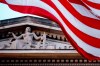 FILE - In this March 22, 2019 file photo, an American flag flies outside the Department of Justice in Washington. (AP Photo/Andrew Harnik)