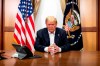 In this image provided by the White House, President Donald Trump listens during a phone call with Vice President Mike Pence, Secretary of State Mike Pompeo, and Chairman of the Joint Chiefs of Staff Gen. Mark Milley, Sunday, Oct. 4, 2020, in his conference room at Walter Reed National Military Medical Center in Bethesda, Md. White House chief of staff Mark Meadows was also in the room, but not pictured, according to the White House. (Tia Dufour/The White House via AP)