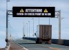 A sign indicates that provincial health department workers will stop traffic that has crossed the Confederation Bridge in Cape Jourimain, N.B. on Sunday, March 22, 2020. Anyone arriving on Prince Edward Island from another province is told to self-isolate for 14 days. This is a step beyond the federal government’s request to those who have travelled internationally. THE CANADIAN PRESS/Andrew Vaughan