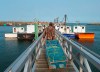 Members of the Sipekne'katik First Nation load lobster traps on the wharf in Saulnierville, N.S., after launching its own self-regulated fishery on Thursday, Sept. 17, 2020. Mi'kmaq communities in Nova Scotia are restocking lobster traps for Indigenous harvesters after a flotilla of non-Indigenous fishing boats removed the gear from St. Mary's Bay over the weekend. THE CANADIAN PRESS/Andrew Vaughan