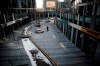 A cleaner walks through a deserted compound of a commercial office building in Beijing, Monday, Feb. 10, 2020. China reported a rise in new virus cases on Monday, possibly denting optimism that its disease control measures like isolating major cities might be working, while Japan reported dozens of new cases aboard a quarantined cruise ship. (AP Photo/Andy Wong)