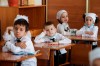 Pupils wearing face masks to protect against coronavirus sit in a classroom during a ceremony marking the start of classes at a school as part of the traditional opening of the school year known as 