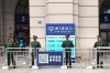 Paramilitary police stand guard at an entrance to the closed Hankou Railway Station in Wuhan in central China's Hubei Province, Thursday, Jan. 23, 2020. China closed off a city of more than 11 million people Thursday in an unprecedented effort to try to contain a deadly new viral illness that has sickened hundreds and spread to other cities and countries in the Lunar New Year travel rush. (Thepaper via AP)