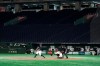 In this Feb. 29, 2020, photo, spectators' stands are empty during play in a preseason baseball game between the Yomiuri Giants and the Yakult Swallows at Tokyo Dome in Tokyo. Japanese officials said Monday, March 9, 2020 they are postponing the start of the 12-team professional baseball league season because of the spread of the coronavirus. (AP Photo/Eugene Hoshiko)
