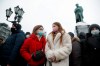 People gather during a protest against the jailing of opposition leader Alexei Navalny in Pushkin square, with the statue of Alexander Pushkin in the background, in Moscow, Russia, Saturday, Jan. 23, 2021. Russian police are arresting protesters demanding the release of top Russian opposition leader Alexei Navalny at demonstrations in the country’s east and larger unsanctioned rallies are expected later Saturday in Moscow and other major cities. (AP Photo/Pavel Golovkin)