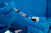 A health worker extracts a dose of the COVID-19 vaccine at the military base in Queretaro, Mexico, Thursday, Dec. 24, 2020. The first batches of vaccines produced by Pfizer and its German partner, BioNTech arrived to Mexico the previous day. (AP Photo/Ginnette Riquelme)