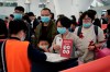 Kin Cheung / The Associated Press
Passengers wear masks to prevent an outbreak of a new coronavirus in the high speed train station, in Hong Kong, Wednesday, Jan. 22, 2020. The first case of coronavirus in Macao was confirmed on Wednesday, according to state broadcaster CCTV. The infected person, a 52-year-old woman, was a traveller from Wuhan. (AP Photo/Kin Cheung)