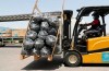 A forklift driver loads material for temporary shelters to be sent to India, at the UNHCR warehouses, part of the International Humanitarian City, in Dubai, United Arab Emirates, Sunday, May 9, 2021. Dubai's long-haul carrier Emirates will begin shipping aid from the World Health Organization and other groups into India for free to help fight a crushing outbreak of the coronavirus, the airline said Sunday. (AP Photo/Kamran Jebreili)