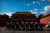 Plainclothes military personnel wearing face masks to protect against the new coronavirus march in formation outside the entrance to the Forbidden City in Beijing, Wednesday, May 27, 2020. The Chinese People's Political Consultative Conference (CPPCC) concluded its session in Beijing on Wednesday, part of the annual meetings of China's two top legislative bodies. (AP Photo/Mark Schiefelbein)