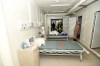 A Chinese army medic looks at a patient room at the Huoshenshan temporary field hospital in Wuhan in central China's Hubei Province, Sunday, Feb. 2, 2020. The Philippines on Sunday reported the first death from a new virus outside of China, where authorities delayed the opening of schools in the worst-hit province and tightened quarantine measures in a city that allow only one family member to venture out to buy supplies. (Chinatopix via AP)