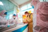 Chinatopix / The Associated Press
Medical workers in protective gear talk with a woman suspected of being ill with a coronavirus at a community health station in Wuhan in central China's Hubei Province, Monday, Jan. 27, 2020. China on Monday expanded sweeping efforts to contain a viral disease by extending the Lunar New Year holiday to keep the public at home and avoid spreading infection. (Chinatopix via AP)